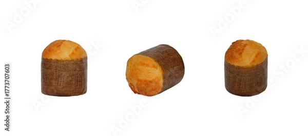 Obraz A horizontal set of three Panettone Christmas cakes in various orientations, wrapped in their paper liners. Perfectly isolated on a white background for holiday or Italian food concepts