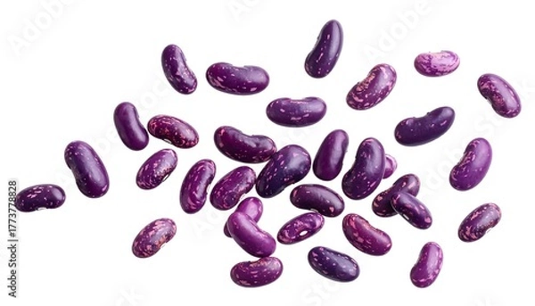 Fototapeta Overhead shot of numerous, vibrant purple-and-red-speckled beans scattered against a stark white backdrop, showcasing their distinct shapes