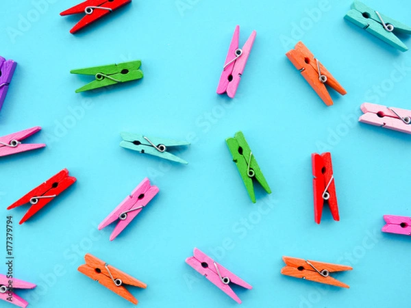 Obraz many colored clothespins on a blue background, as a substrate, pin; clothes peg