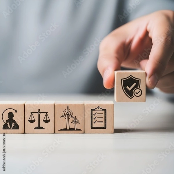 Fototapeta Hand places wooden block with shield and checkmark symbolizing security and compliance