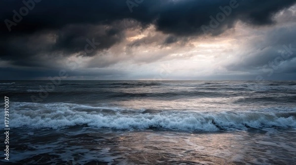 Fototapeta Photograph of a stormy sea. the sky is filled with dark, ominous clouds that are covering the entire horizon. the clouds are dark and billowing, creating a dramatic and ominous atmosphere.