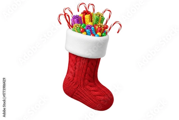 Fototapeta Red Christmas stocking with white fluffy top, filled with candy canes and small gifts, isolated on transparent background, realistic style.