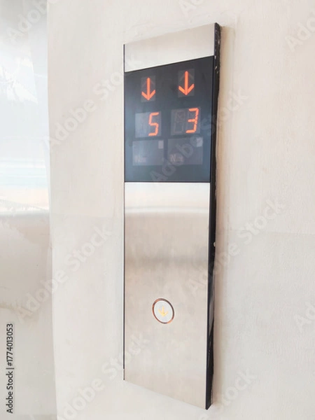 Fototapeta Modern Elevator Call Button Panel Showing Digital Floor Numbers and Directional Arrows