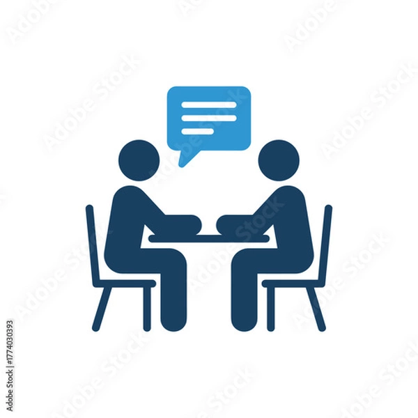 Obraz Two people sitting at a table with a blue speech bubble above them, representing conversation or meeting