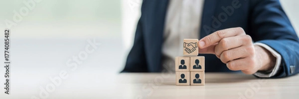 Fototapeta Building a successful team wooden blocks with people icons concept for human resources and teamwork