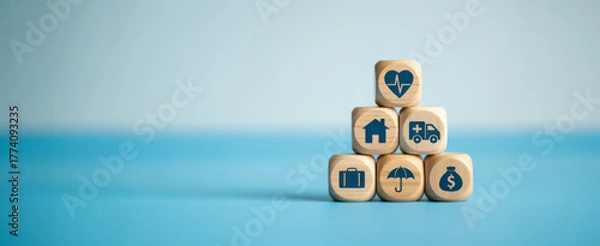 Fototapeta Wooden blocks with insurance icons stacked in a pyramid representing protection and security for financial planning and risk management concepts