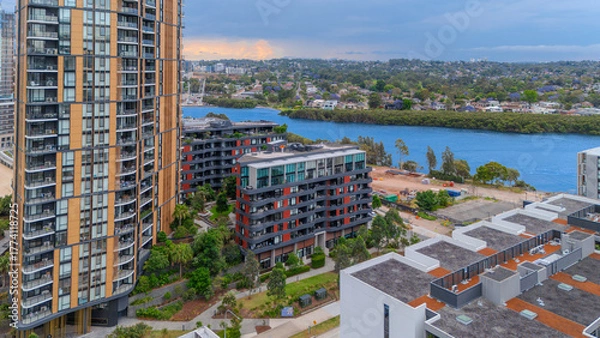 Fototapeta Aerial Drone View of Wentworth Point and Rhodes a suburb in western Sydney newly built residential high rise apartments area on Parramatta River Sydney NSW Australia