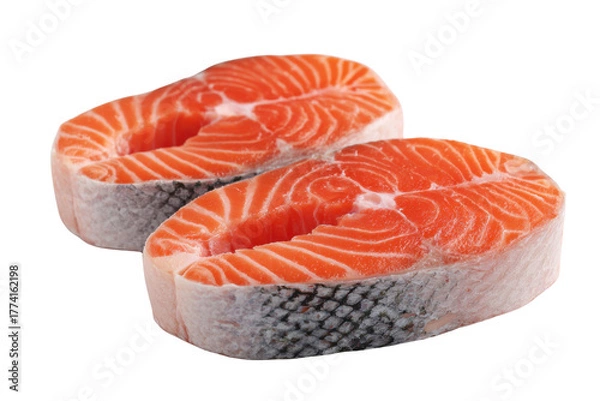 Fototapeta Two fresh salmon steaks with white flesh and orange meat on black fish food, Isolated On Transparent Background, Png Cut Out
