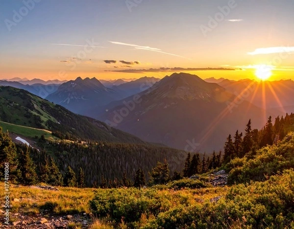 Obraz A breathtaking landscape photo showing a brilliant sun rising over majestic mountain ranges. The light bathes the peaks & valleys
