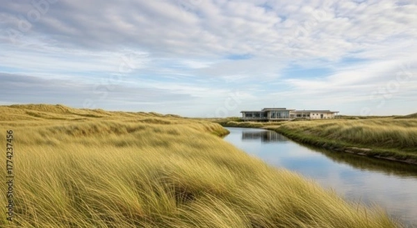 Obraz Modern coastal residence on the serene riverbank surrounded by dunes