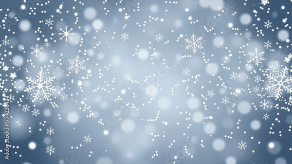 Fototapeta Delicate snowflakes gently fall against a soft, blurred blue background, creating a serene and magical winter atmosphere filled with the charm of the season.