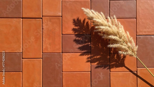 Fototapeta ears of wheat on a red tile