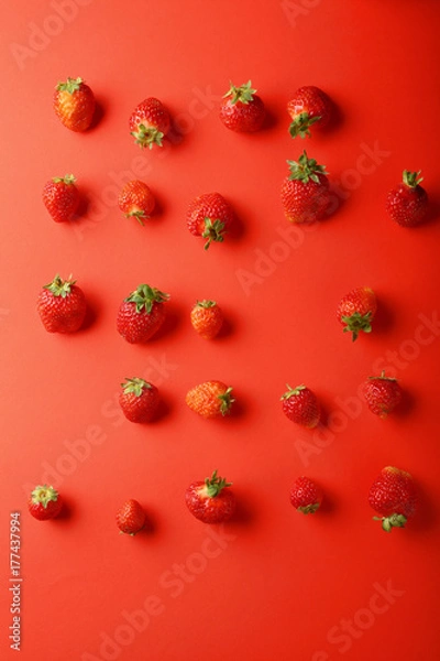 Obraz Fresh strawberries on red