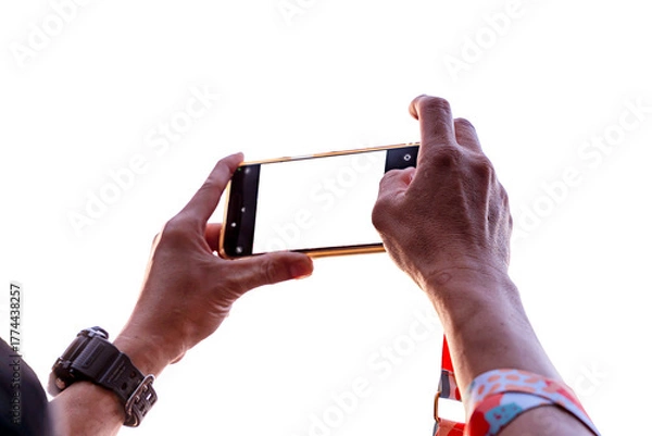 Fototapeta Closeup and back view hand of human hold and taking photography by smartphone isolated on white background.