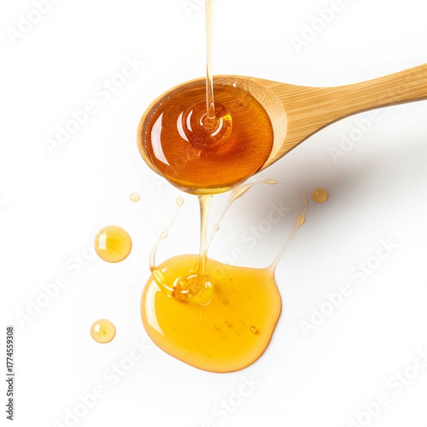 Obraz Honey dripping from wooden dipper on white background, natural sweetness concept