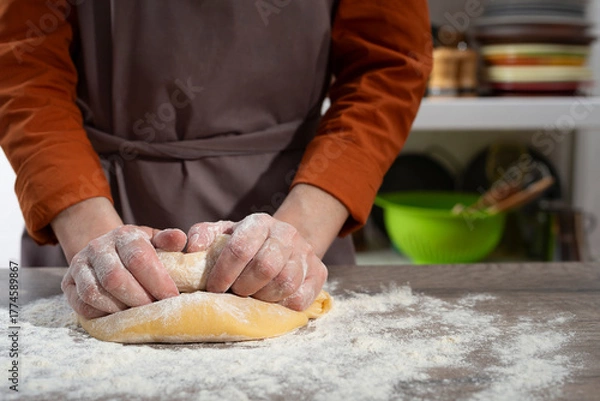 Obraz Baking concept. Caucasian female hands kneading the dough.
