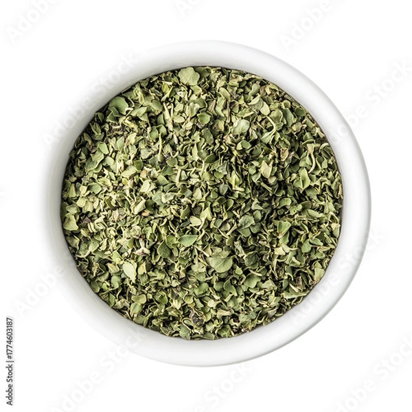 Fototapeta Dried chopped basil in white ceramic bowl Isolated transparent on white background