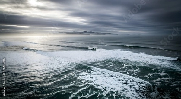 Fototapeta Dramatic Ocean Waves Under Cloudy Sky