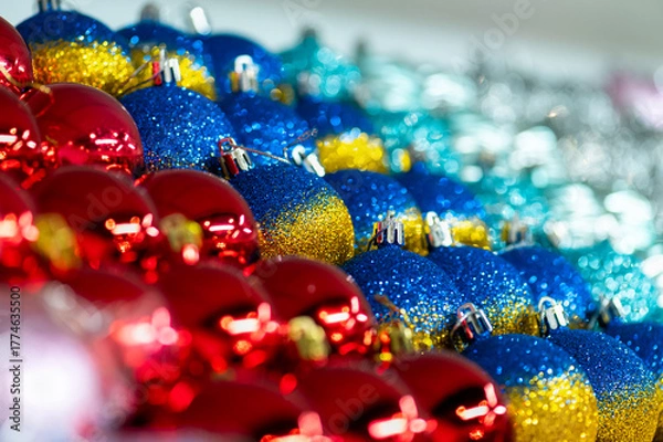 Obraz Colorful glitter Christmas baubles in red blue and gold