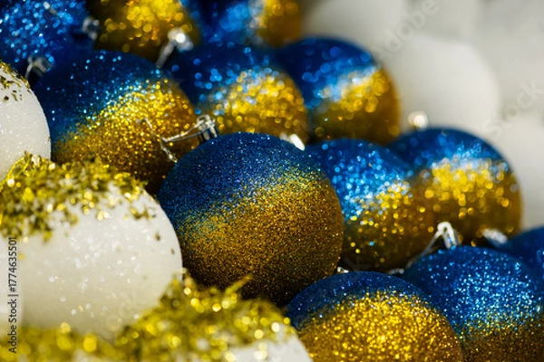 Obraz Blue and gold glitter Christmas ornaments with bokeh lights