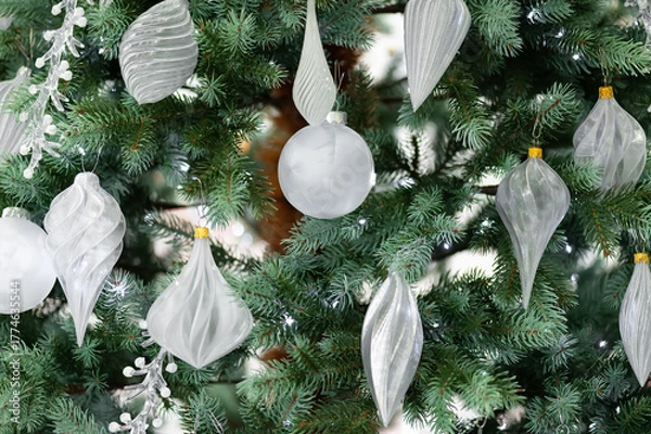Obraz White glass Christmas ornaments on green fir tree