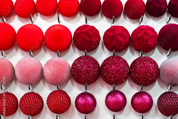 Obraz Red and pink Christmas baubles arranged in rows