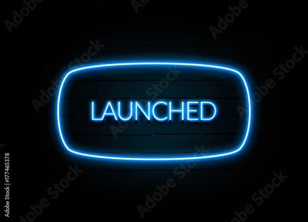 Fototapeta Launched  - colorful Neon Sign on brickwall