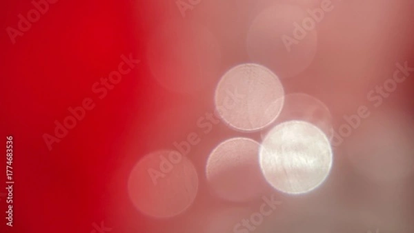 Obraz Soft red and pink blurred background with circular bokeh light patterns.