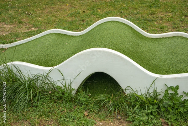 Fototapeta Mini golf lane with wavy hills and tunnel horizontal