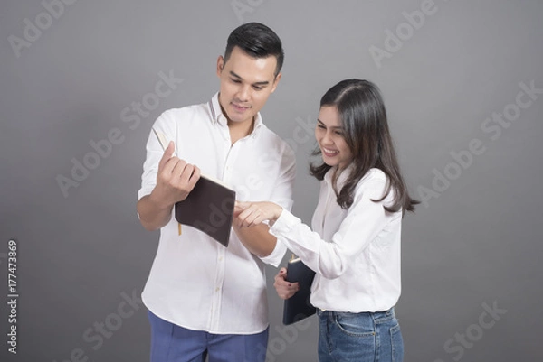 Obraz university students on grey background,Study abroad concept