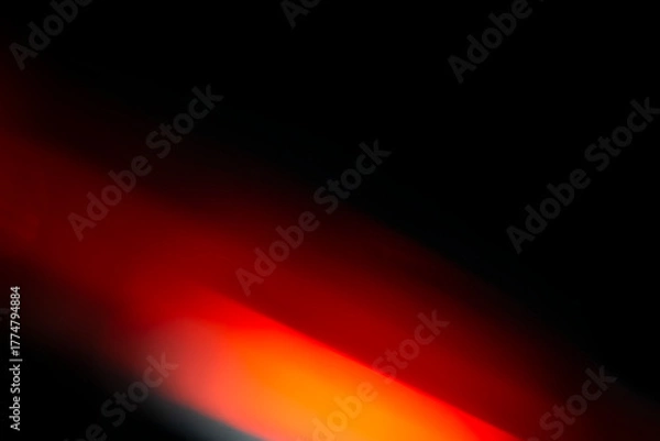 Obraz Abstract motion blur of bright red and orange city street lights creating a dark, colorful bokeh fire effect