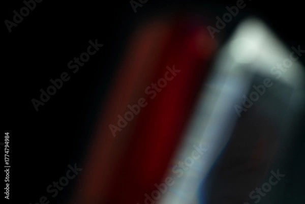 Obraz Abstract motion blur of bright red and orange city street lights creating a dark, colorful bokeh fire effect