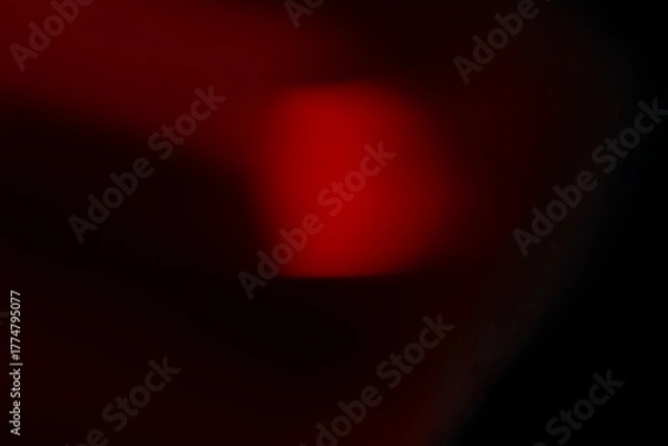 Obraz Abstract motion blur of bright red and orange city street lights creating a dark, colorful bokeh fire effect