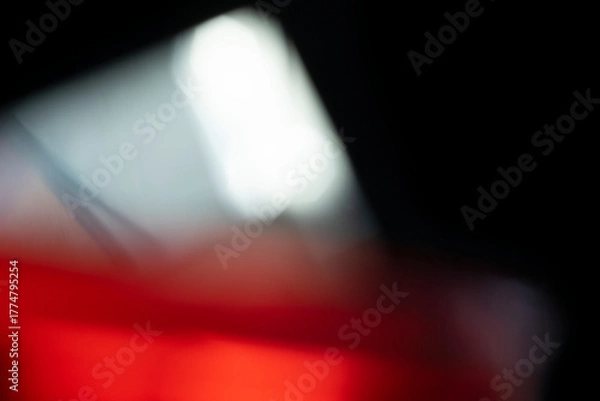 Obraz Abstract motion blur of bright red and orange city street lights creating a dark, colorful bokeh fire effect