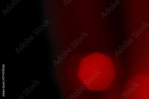 Obraz Abstract motion blur of bright red and orange city street lights creating a dark, colorful bokeh fire effect