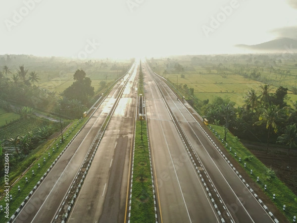 Fototapeta aerial view of the higway with beautiful views at sunrise