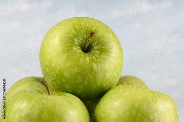 Fototapeta Image of five granny smith apples.