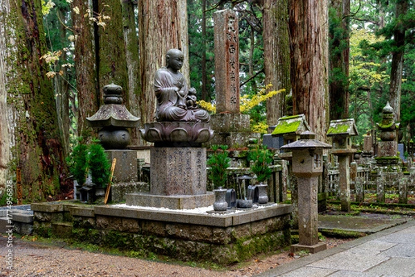 Fototapeta It is considered the largest cemetery in Japan, with more than two hundred thousand graves and memorial monuments. It is located on the sacred Mt. Koya and is immersed in a forest of tall conifers.
