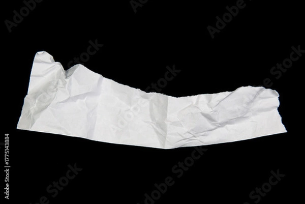 Fototapeta White paper cut with torn edges isolated on black background.