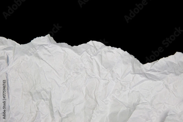 Obraz White paper cut with torn edges isolated on black background.