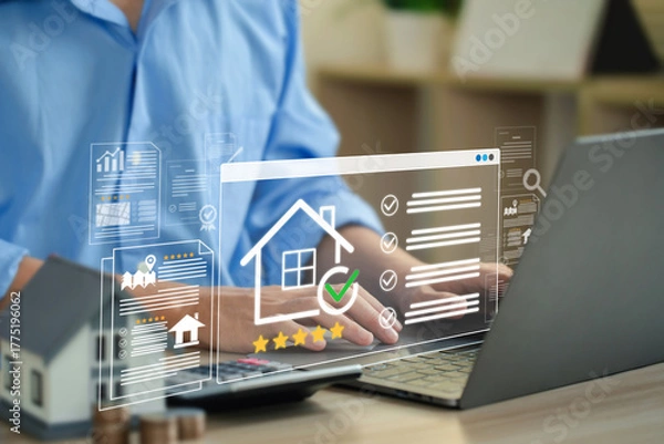 Fototapeta Hands on a laptop with transparent UI of house icon, checklist, and star rating, showing online real estate, property evaluation, mortgage approval, and digital home buying on proptech platforms.