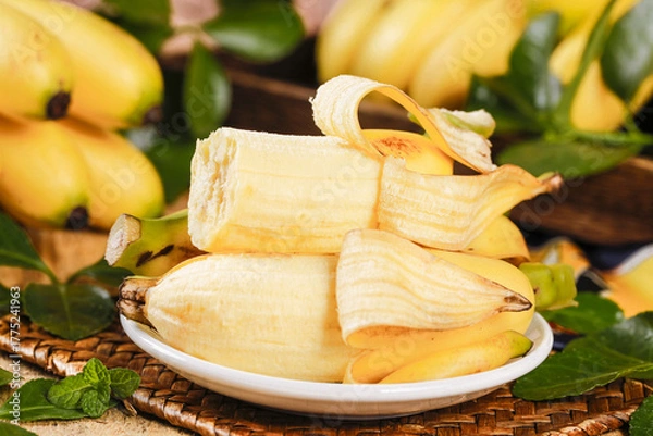 Obraz Fresh Hainan Imperial Bananas Sliced on Plate - Sweet Tropical Fruit Display