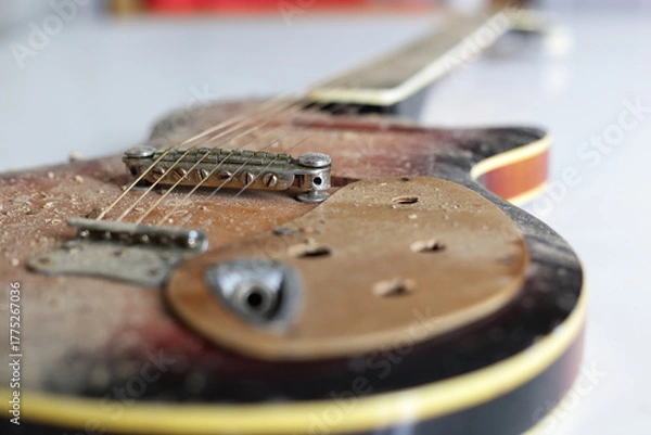 Fototapeta Musical instrument - Closeup fragment old, dirty, broken guitar. Bridge