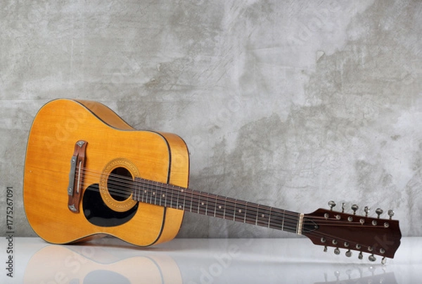 Fototapeta Musical instrument - Vintage rare twelve-string acoustic guitar with a reflection