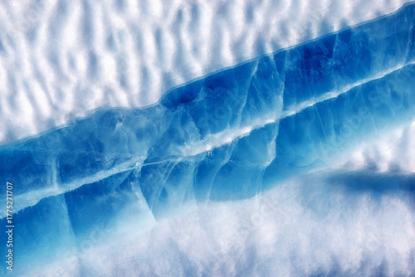 Fototapeta Blue ice seam in an iceberg, Kjerulf fjord, Northeast Greenland National Park. These layers are formed when meltwater enters a crevasse and freezes quickly without air bubbles forming.