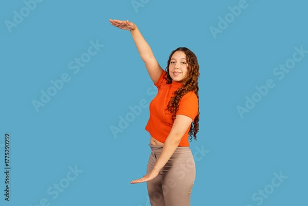 Obraz Young woman gesturing, showing large amount or size