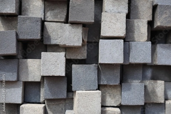 Fototapeta Stacked cement blocks in random pattern creating 3D texture composition