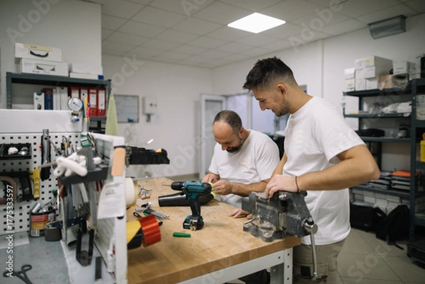 Obraz Coworkers working together in workshop