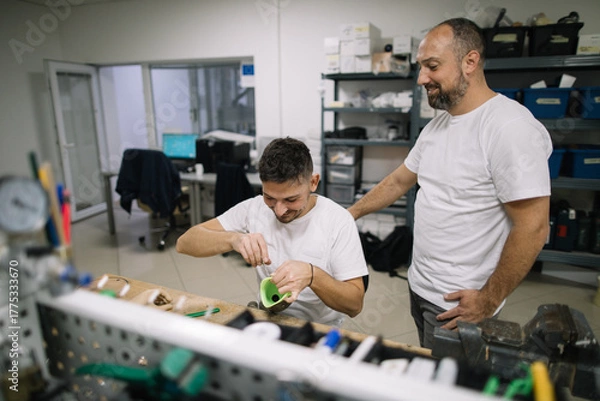 Obraz Coworkers working together in workshop