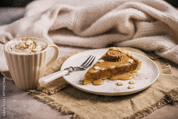 Fototapeta Piece of pumpkin pie with caramel sauce and cookie